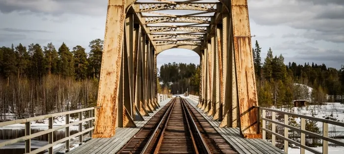 Wood and metal railroad bridge in Winter.