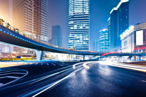 Light trails on modern buildings in big city at night.