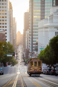 View of street car along busy street in San Francisco.