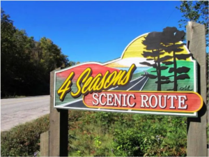 4 Seasons Scenic Route painted, wooden sign.