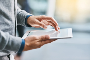 Hands of a citizen using digital tablet.