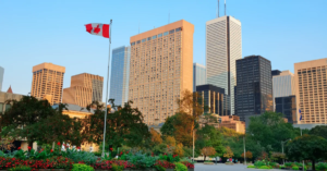 Toronto street view at dusk with urban buildings.