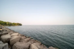 View of lake and rocky shore, Sioux Lookout.