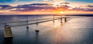 Aerial panorama of Chesapeake Bay Bridge at sunset.