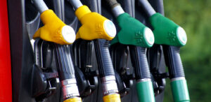 Close up of yellow and green gas pump handles.