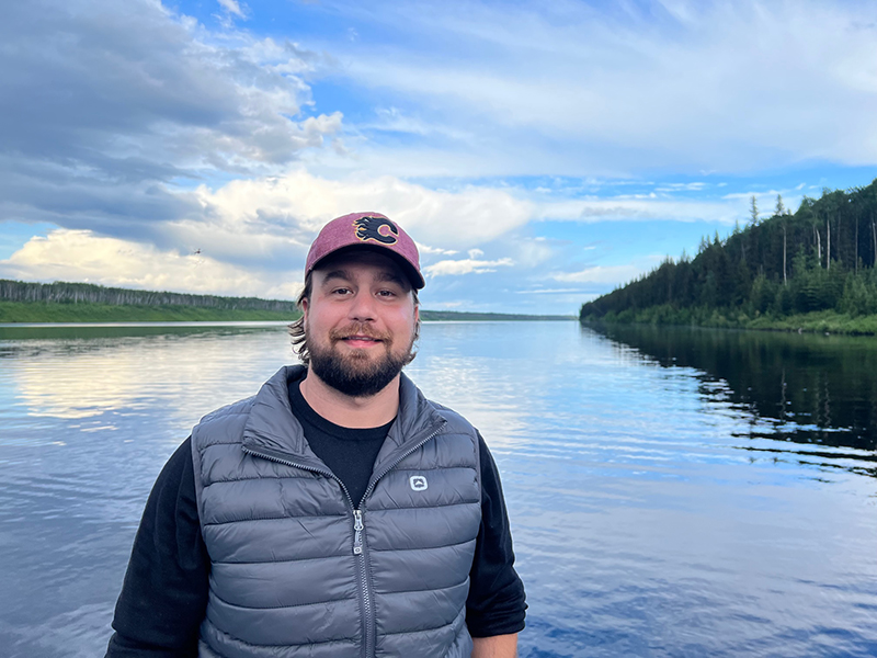 PSD Citywide staff member standing in front of lake.