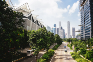 Elevated view of big city street with high rise buildings on either side.
