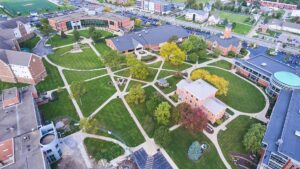Aerial view of a college campus in northeast Indiana with buildings, pathways, and green areas, showing the scale of campus infrastructure.