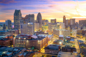 Aerial view of downtown Detroit skyline at twilight, representing Michigan infrastructure and municipal development